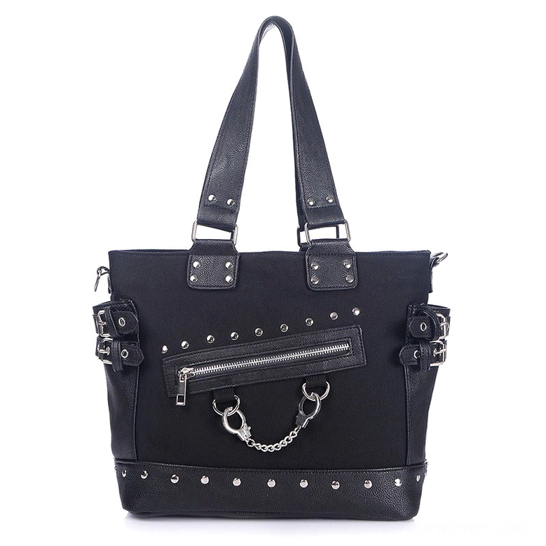 Black gothic canvas tote bag front view with handcuff chain and rivet embellishments, displayed flat on white background