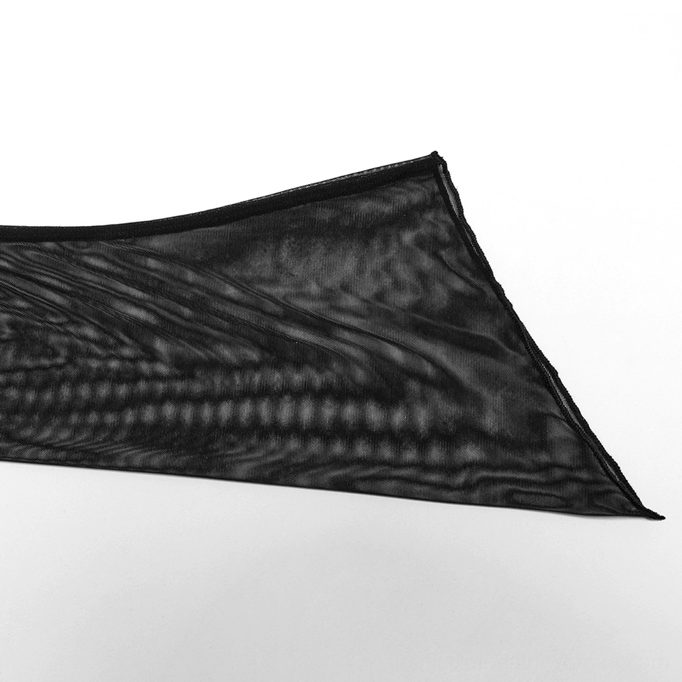 Close-up of black gothic cape pointed irregular hem edge and sheer mesh fabric texture