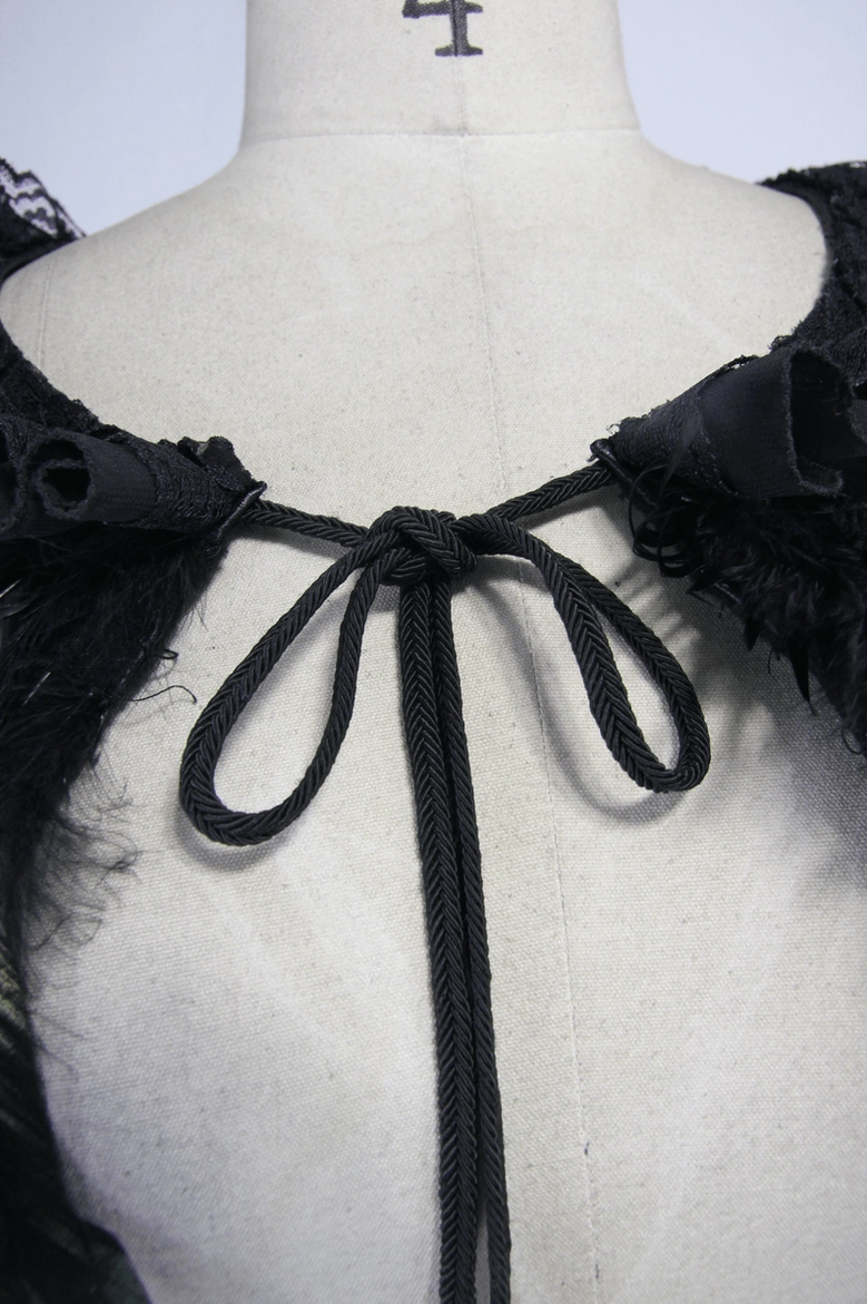 Gothic shoulder cape back closure detail showing black braided drawstring and lace trim on dress form