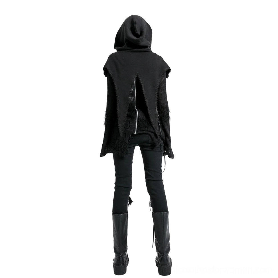 Punk style hooded black knit cape back view on female model with split back zipper decoration, paired with black pants and boots