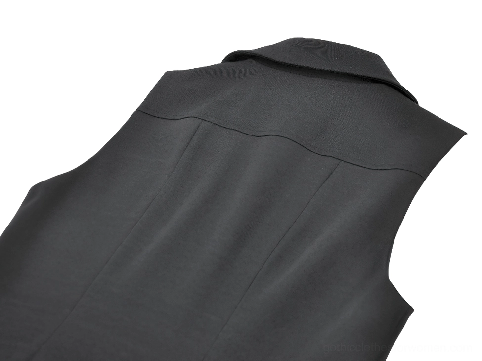 Gothic cape back yoke seam detail - sleeveless armhole design and neat construction of black studded cape