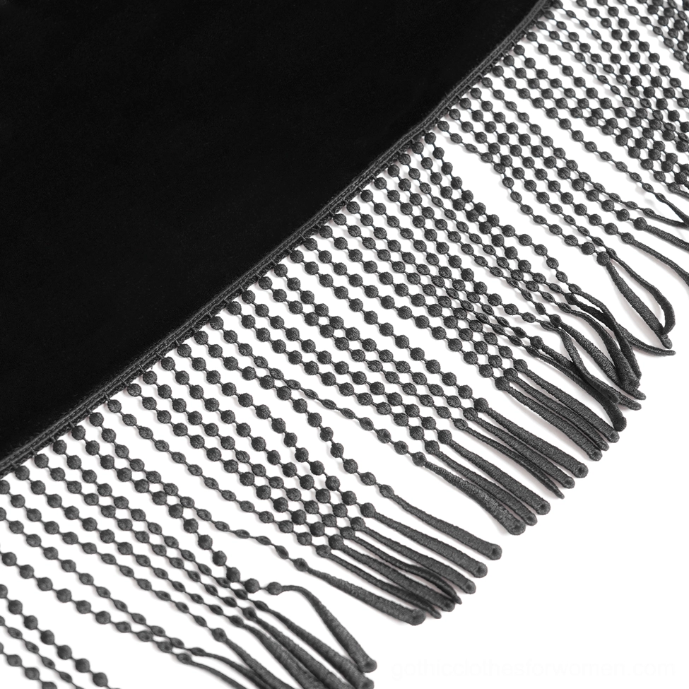 Macro close-up of beaded tassel fringe trim and woven mesh detail on gothic cape hemline showing craftsmanship
