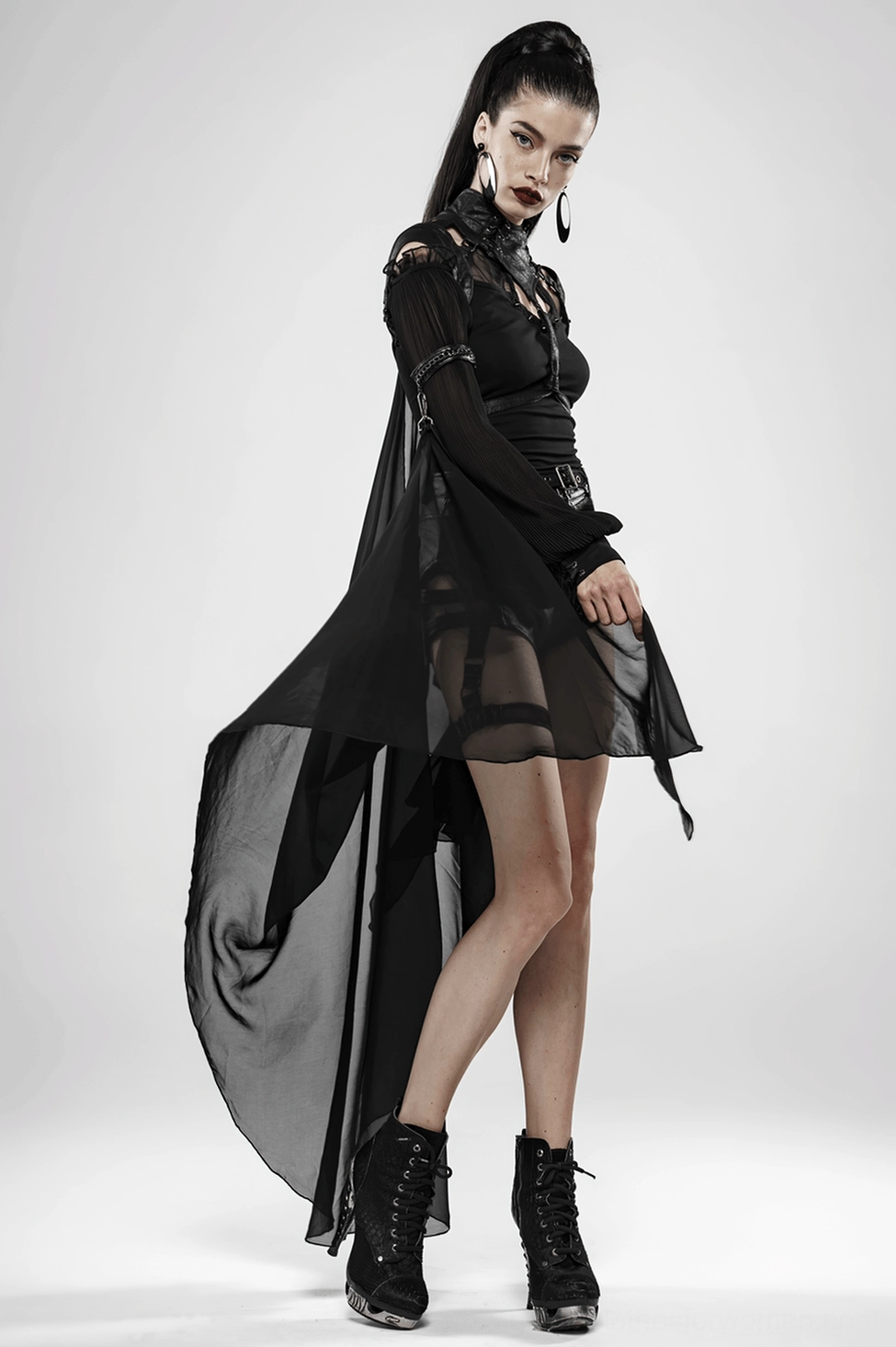 Chiffon draping and movement of gothic batwing cape in studio lighting