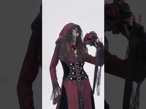 Gothic hooded cape with corset waist detail and red rose decoration, side view