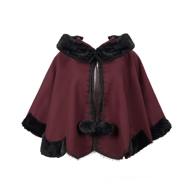 Red gothic cape flat lay showing double pom-pom closures and lace-edged scalloped hemline detail