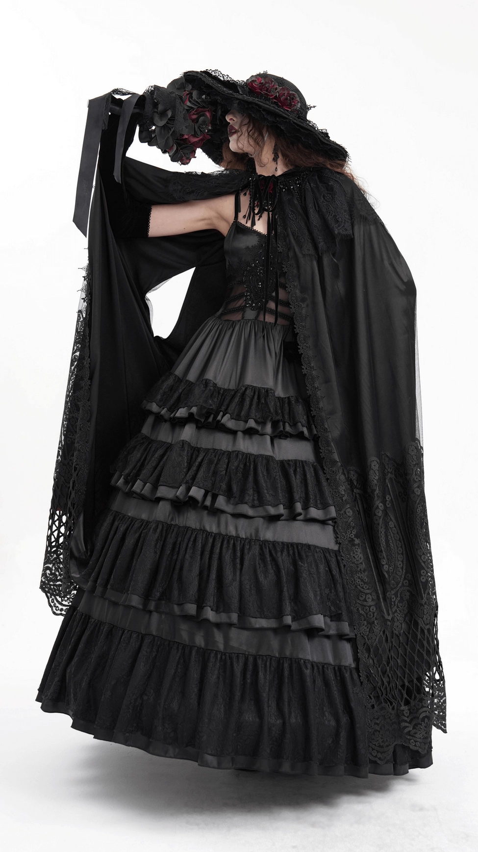 Side view of floor-length hooded gothic cape on mannequin displaying dramatic silhouette and mesh overlay