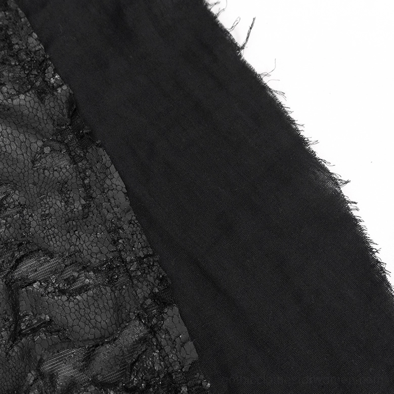 Close-up texture detail of frayed raw edge and matte black knit fabric with distressed finish