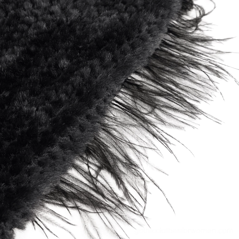 Detailed view of gothic cape feathered trim and fluffy grainy plush texture with black fuzzy finish