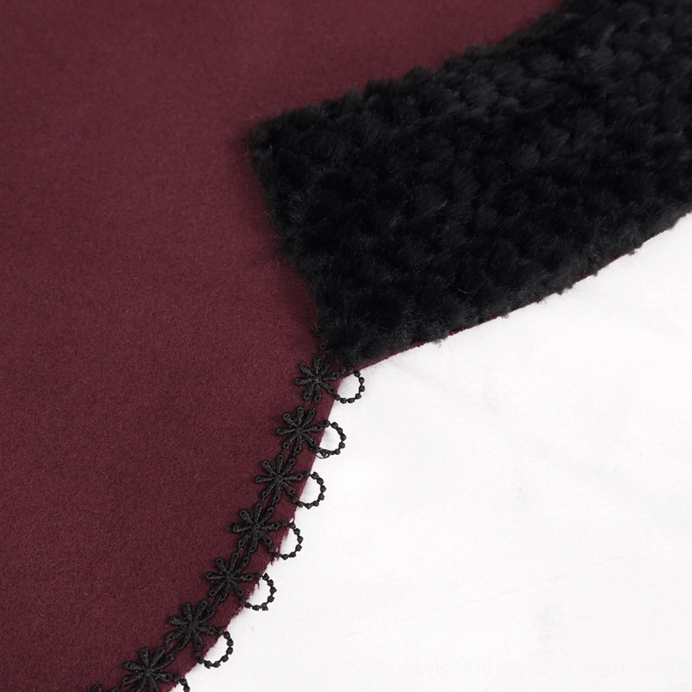 Gothic red cape detail showing scalloped hem construction with black fur and embroidered lace