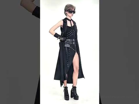 Gothic cape side slit view - model wearing dramatic black sleeveless coat with harness neck detail and extended length