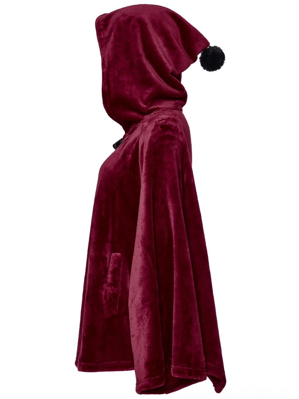 Left side profile view of wine red velvet cape with black faux fur pompom hood trim and concealed side pocket