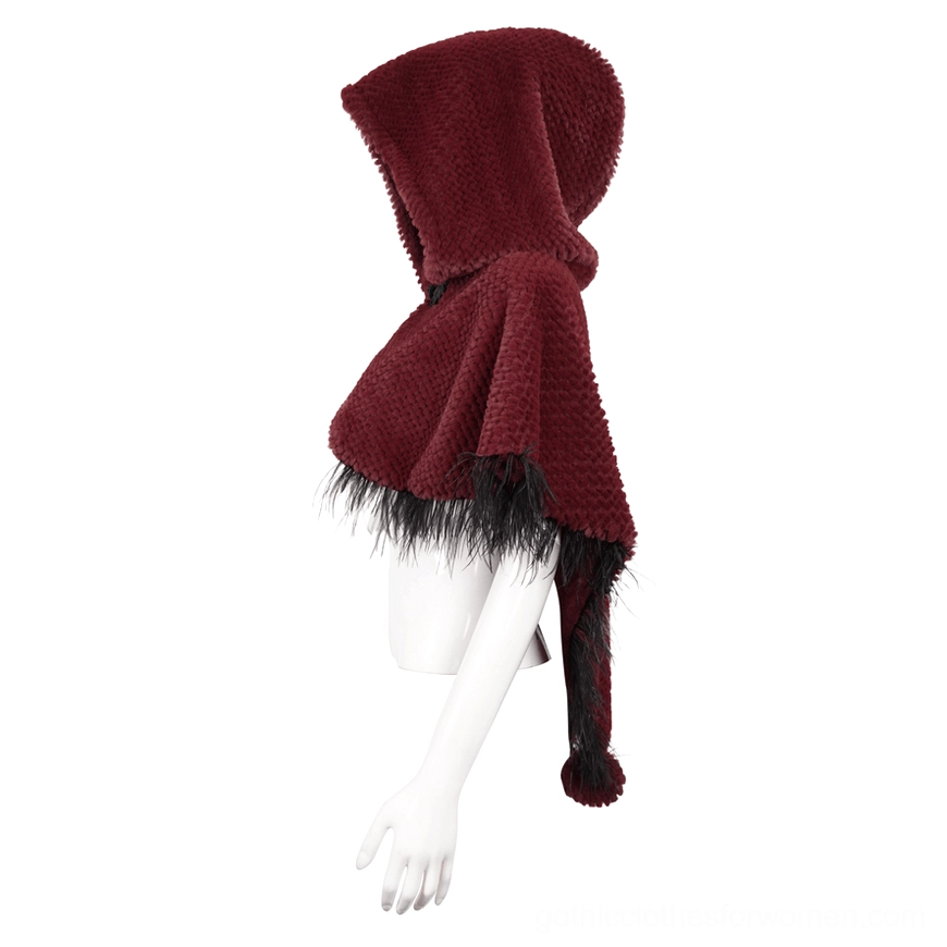 Side view of wine red gothic cape showing hanging fur pompon and grainy plush fabric texture