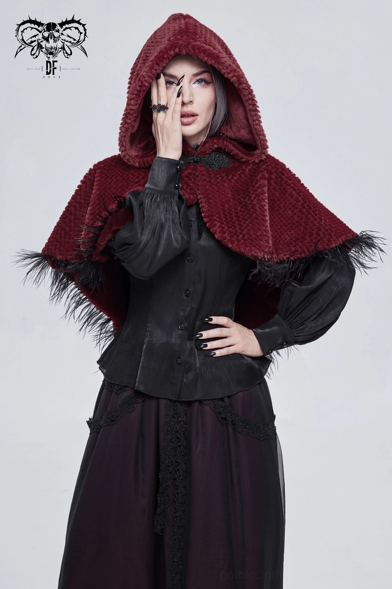 Female gothic model wearing wine red hooded cape with matching black gothic blouse and skirt outfit