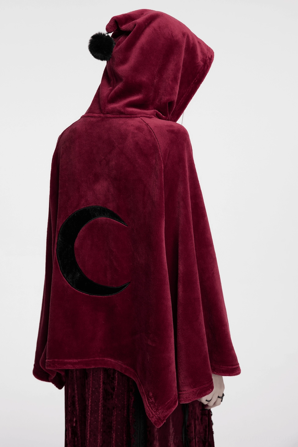 Burgundy hooded moon cape worn by goth model, three-quarter view showing drape and silhouette
