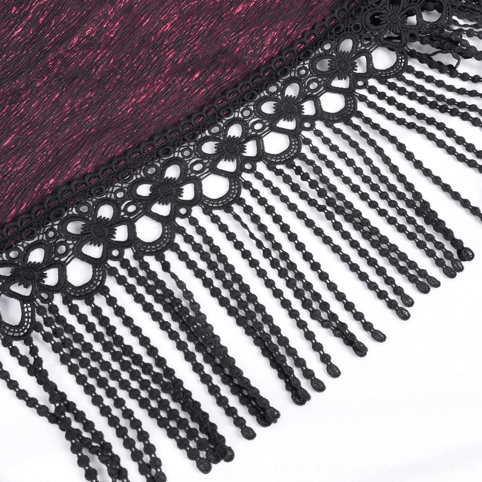 Wine-red gothic fabric detail with wrinkled texture, black lace and beaded tassel trim close-up