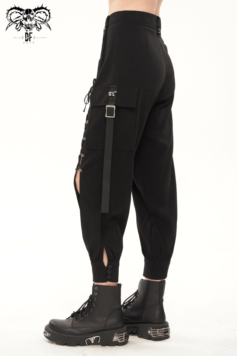 Black gothic cargo jogger pants styled with alternative fashion accessories showing complete outfit presentation with skull hardware emphasis