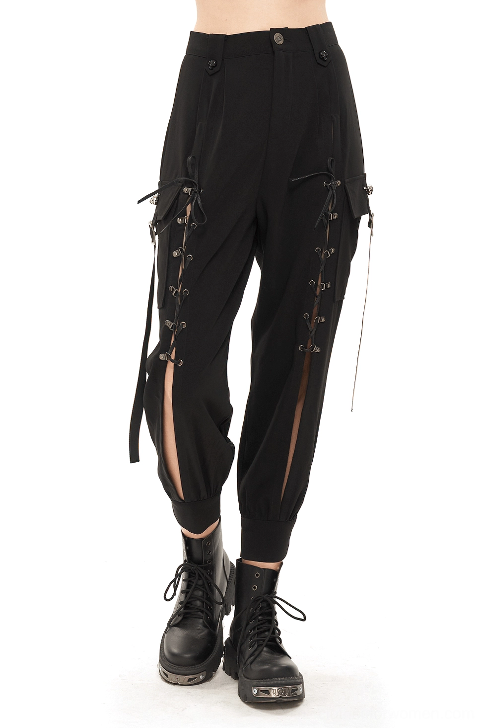Black gothic cargo jogger pants with skull lace-up straps front view on female model wearing black pants with hollow-out side details and tapered hem