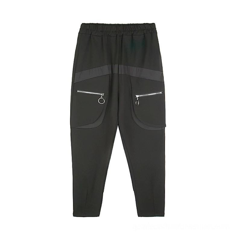 Black gothic harem cargo pants flat lay front view showing contrast waist panel and functional pockets