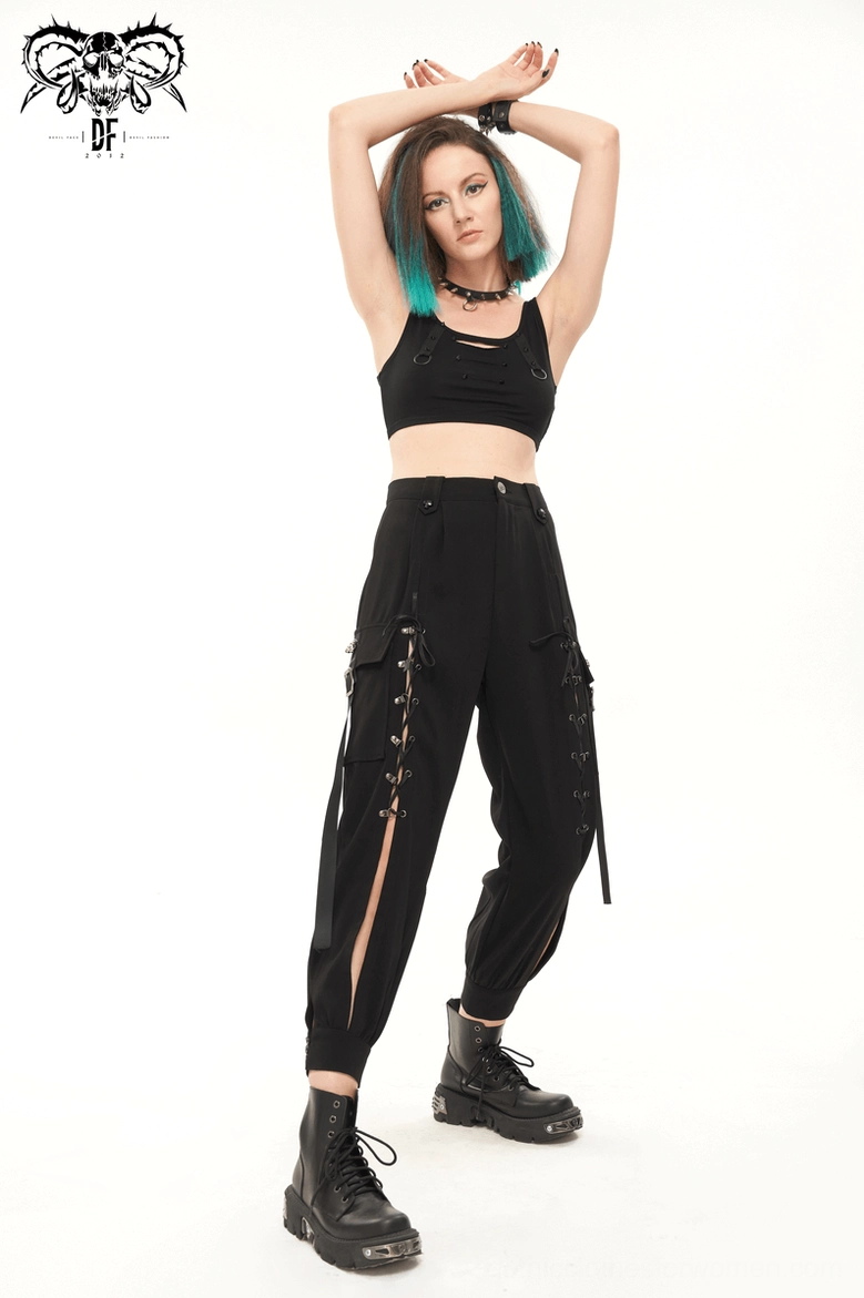 Detail shot of gothic cargo pants leg opening showing cropped tapered hem construction and matte black fabric refinement