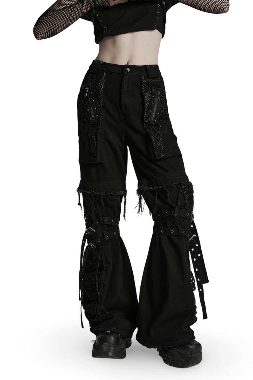Black detachable gothic cargo pants with mesh pockets and studded straps, front three-quarter view on model
