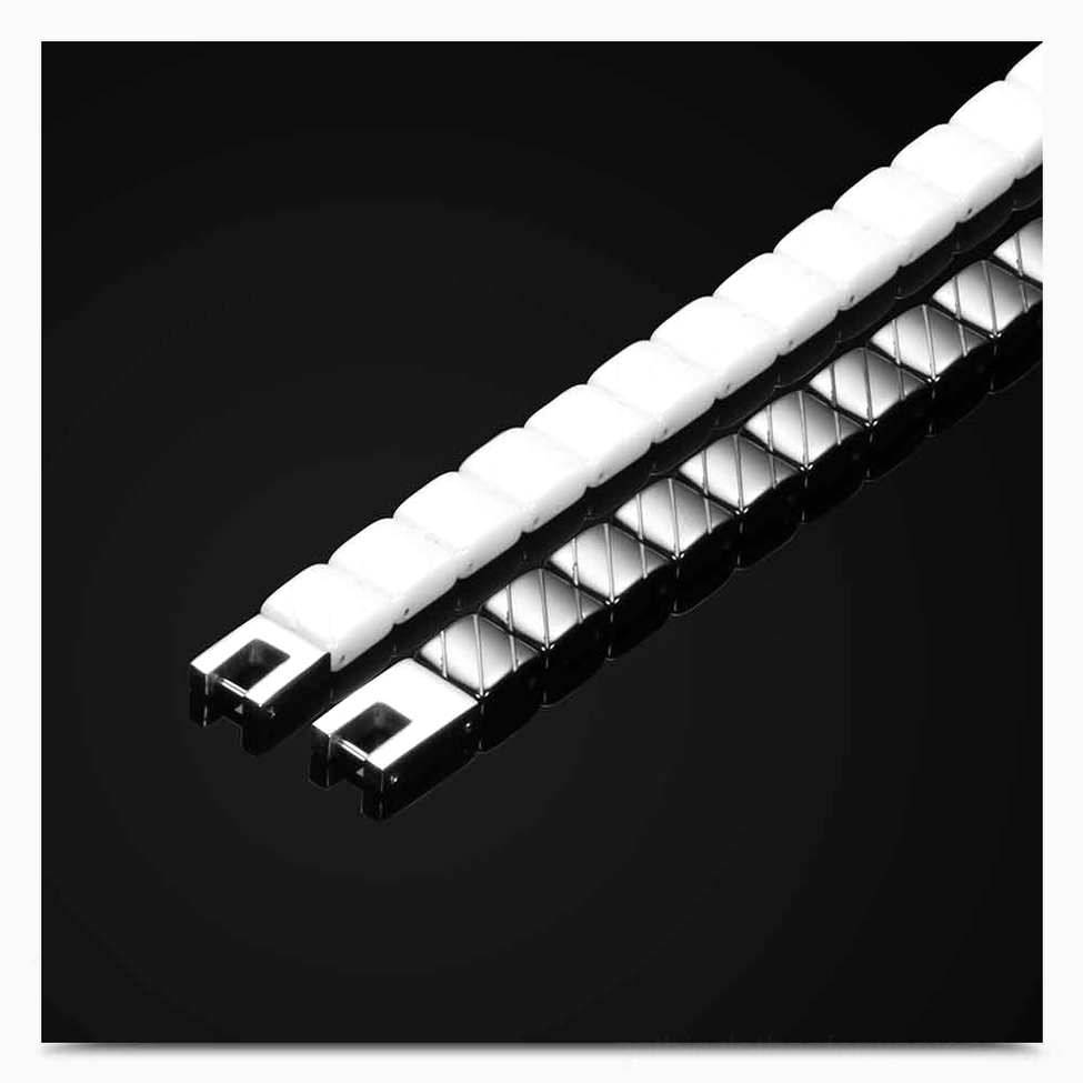 Monochrome ceramic and stainless steel bracelet link assembly showing construction quality