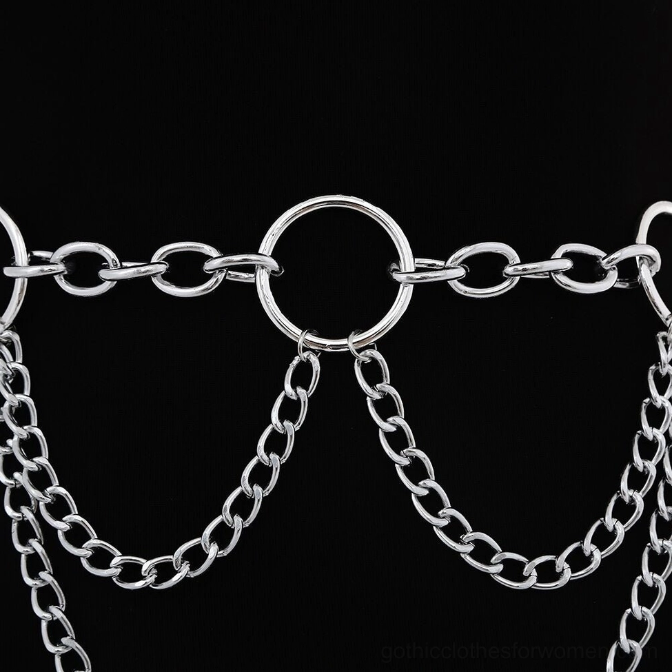 Detailed close-up of mixed thickness metal chain links and circular connection hardware in gothic style