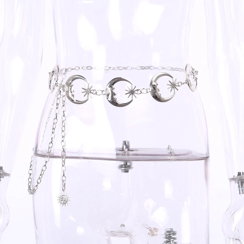 Crescent moon and sun pendant chain belt shown on mannequin from side waist angle, silver metal finish
