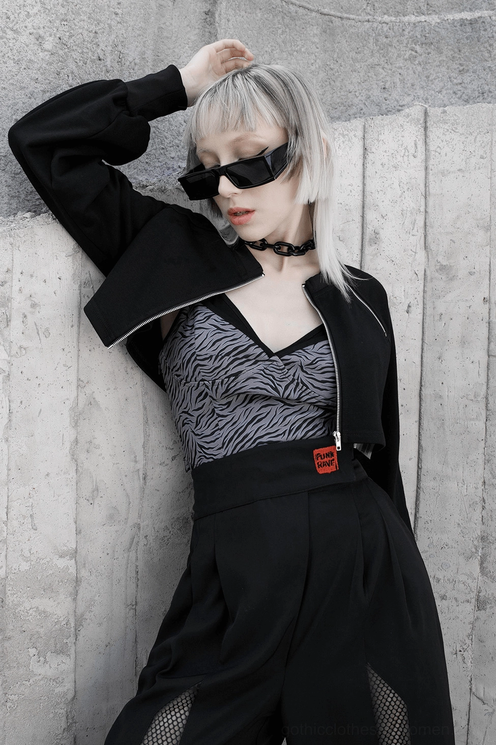 Detailed view of black gothic crop jacket neckline, collar construction, and upper shoulder seaming