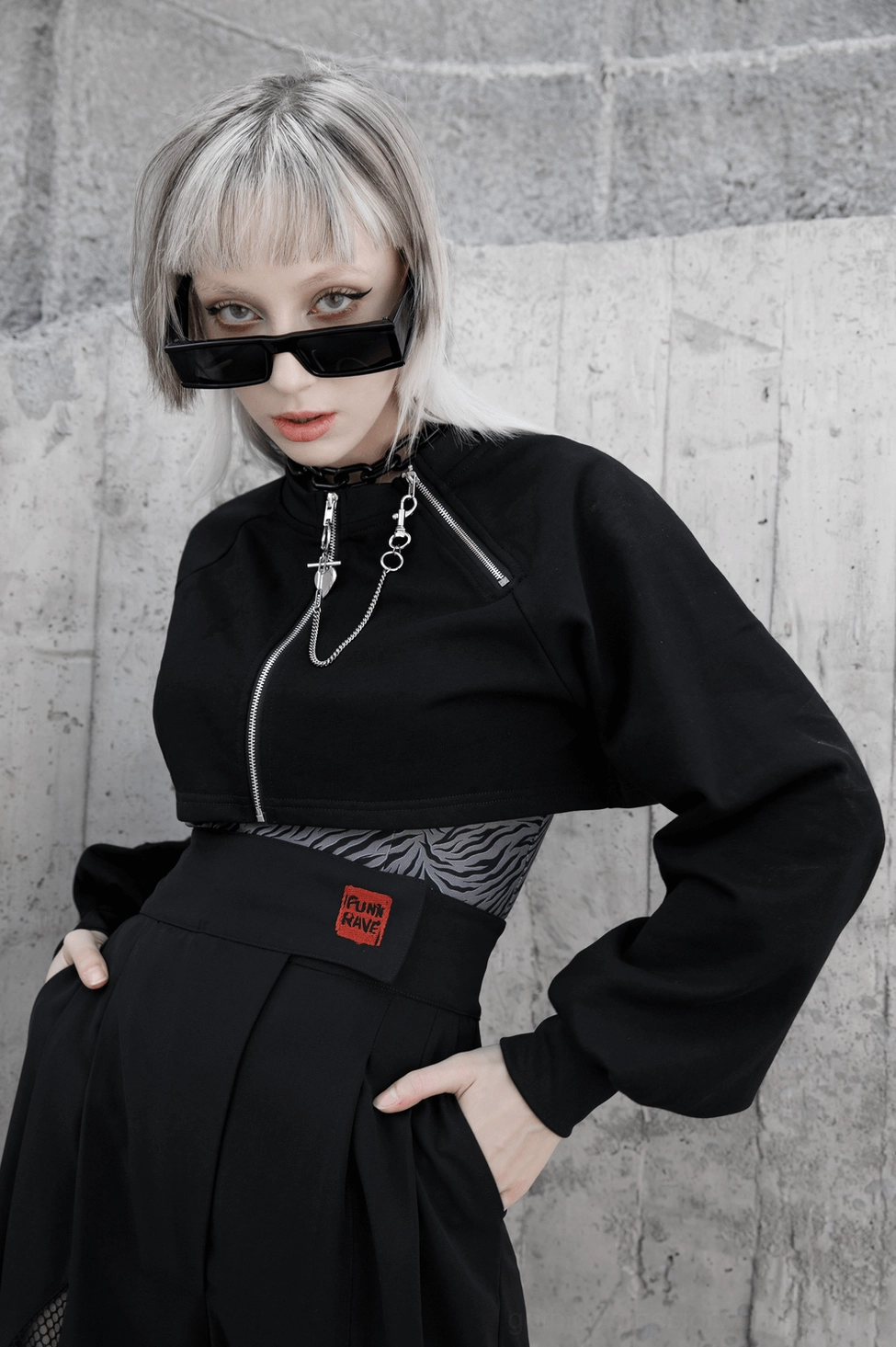 Black gothic crop jacket detail showing fabric quality, weave texture, and hardware durability