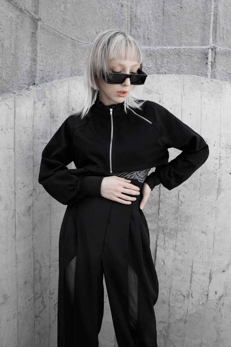 Overhead shot of black gothic crop jacket displaying full garment construction and proportions
