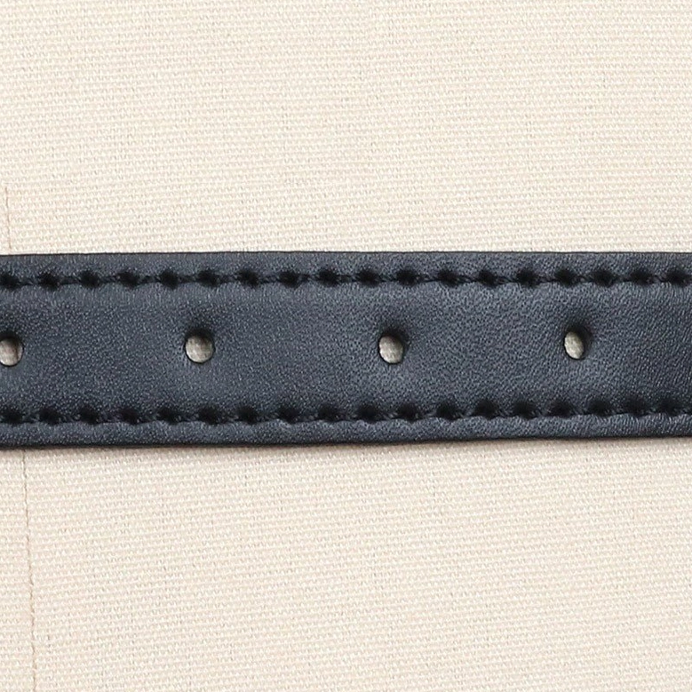Detailed view of silver-tone metal chains and circular rings used in chest harness construction