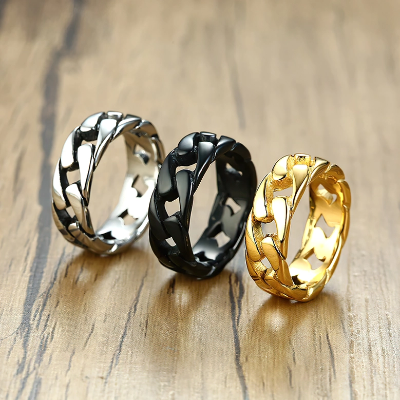 Complete gothic chain link ring set all three finishes displayed together on wooden surface, alternative jewelry styling