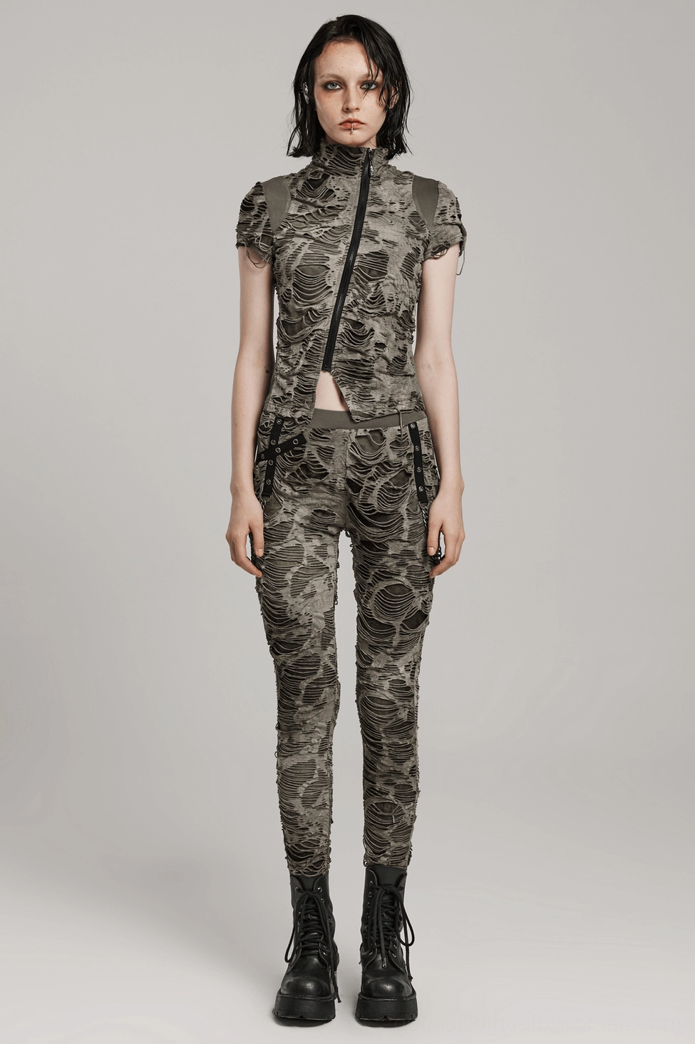 Gothic chain distressed trousers detail showing chain hardware, ripped layers, and slim-fitted silhouette from side angle