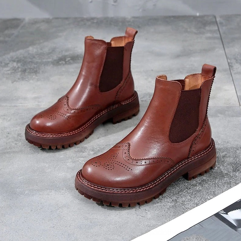 Non-slip rubber outsole of gothic Chelsea boots showing industrial lug tread pattern