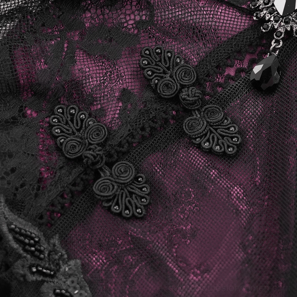 Close-up of gothic cheongsam dress embossed lace fabric with decorative frog closures and beaded details