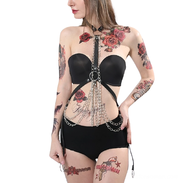 Sexy alternative leather chest harness styled with black bra and shorts, three-quarter angle view