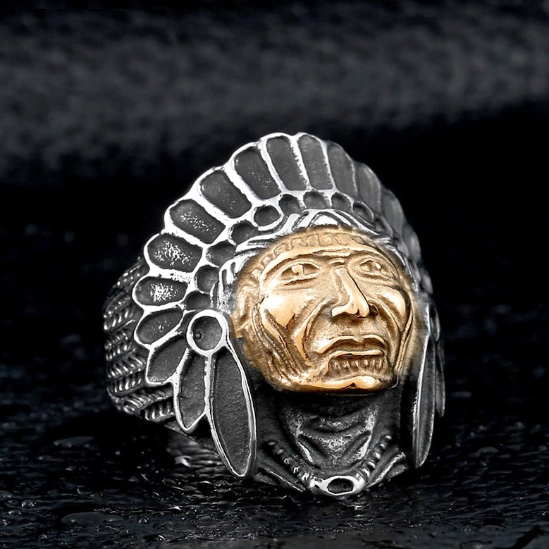 Gothic chief skull ring close-up with detailed feather headdress carving on leather background