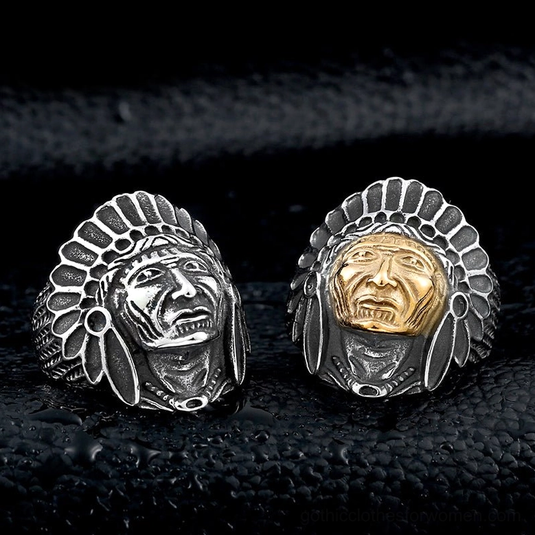 Gothic chief skull rings pair one silver one dual-tone on black leather background