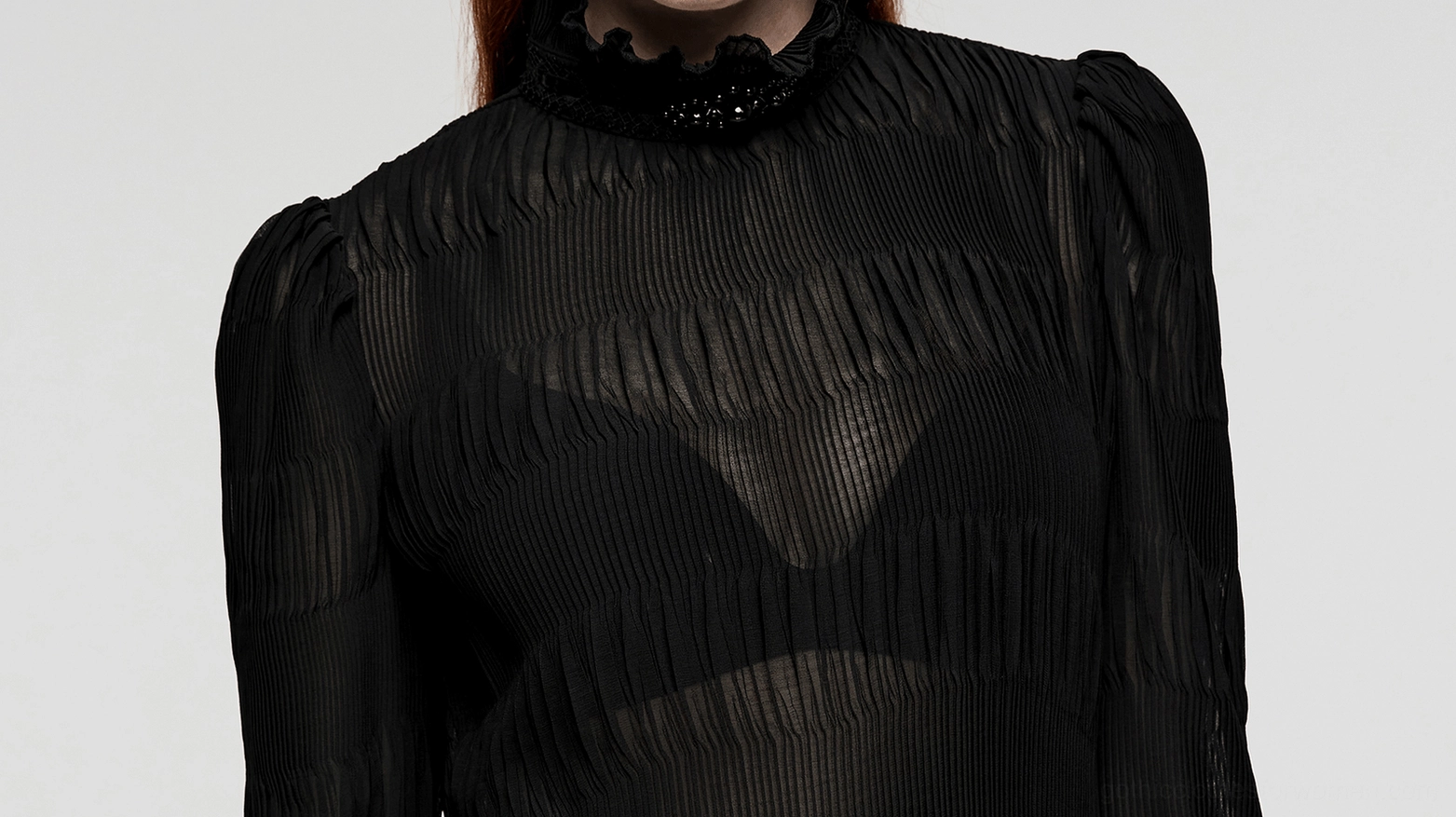 Close-up front view of model wearing gothic chiffon blouse with beaded ruffled collar detail