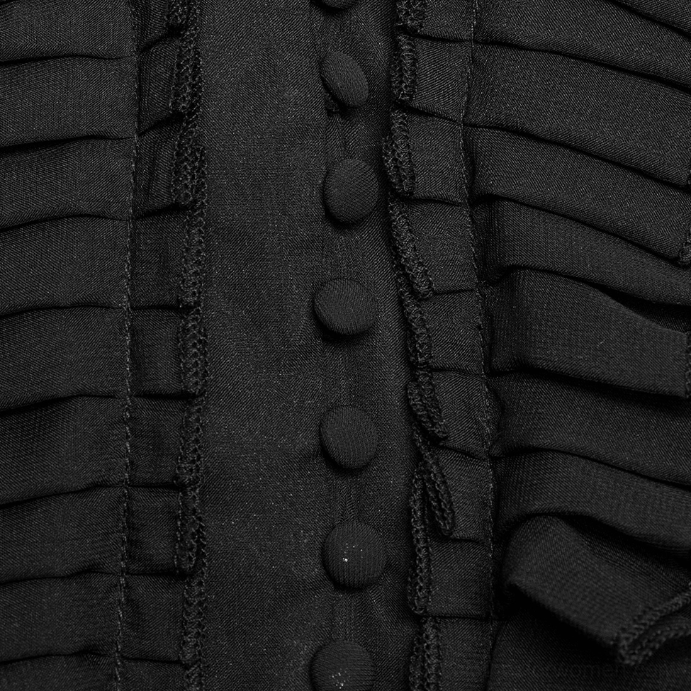 Black chiffon gothic dress fabric close-up detail showing ruffled trim and fabric-covered button strip on placket