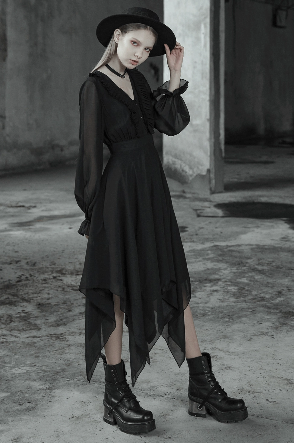 Black asymmetrical chiffon gothic dress front view on mannequin displaying complete V-neck and sleeve silhouette