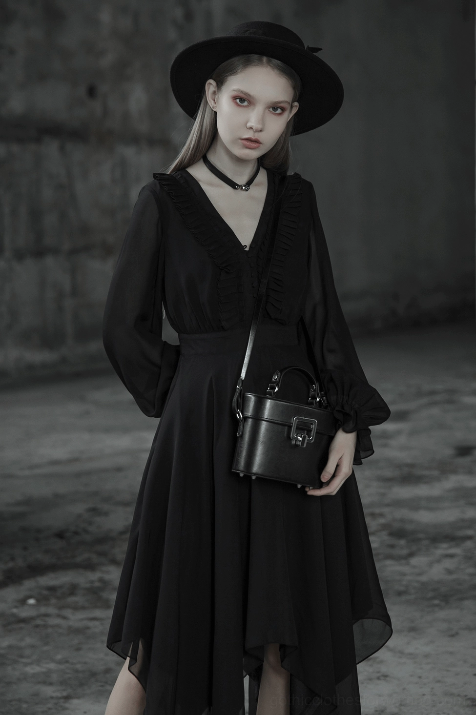 Black asymmetrical chiffon gothic dress side detail showing sheer sleeve construction and hem layering
