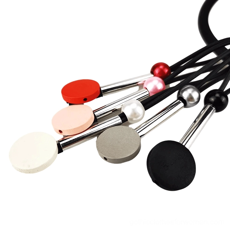 Gothic choker bead components close-up showing red pink grey white and black matte beads with metal rod accents