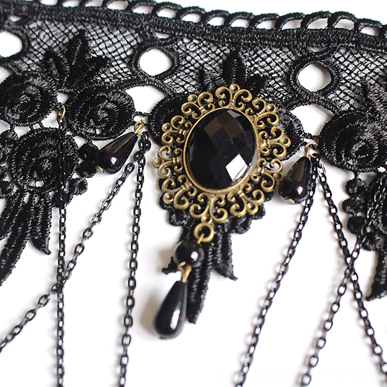 Close-up macro shot of gothic choker necklace highlighting vintage bronze frame, black gemstone centerpiece, and fine lace detailing