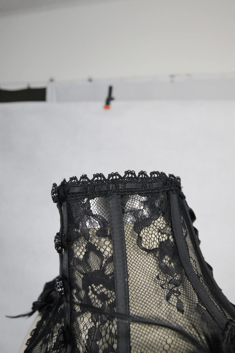 Gothic black lace collar showing complete embellishment design with roses, feathers, and wing details