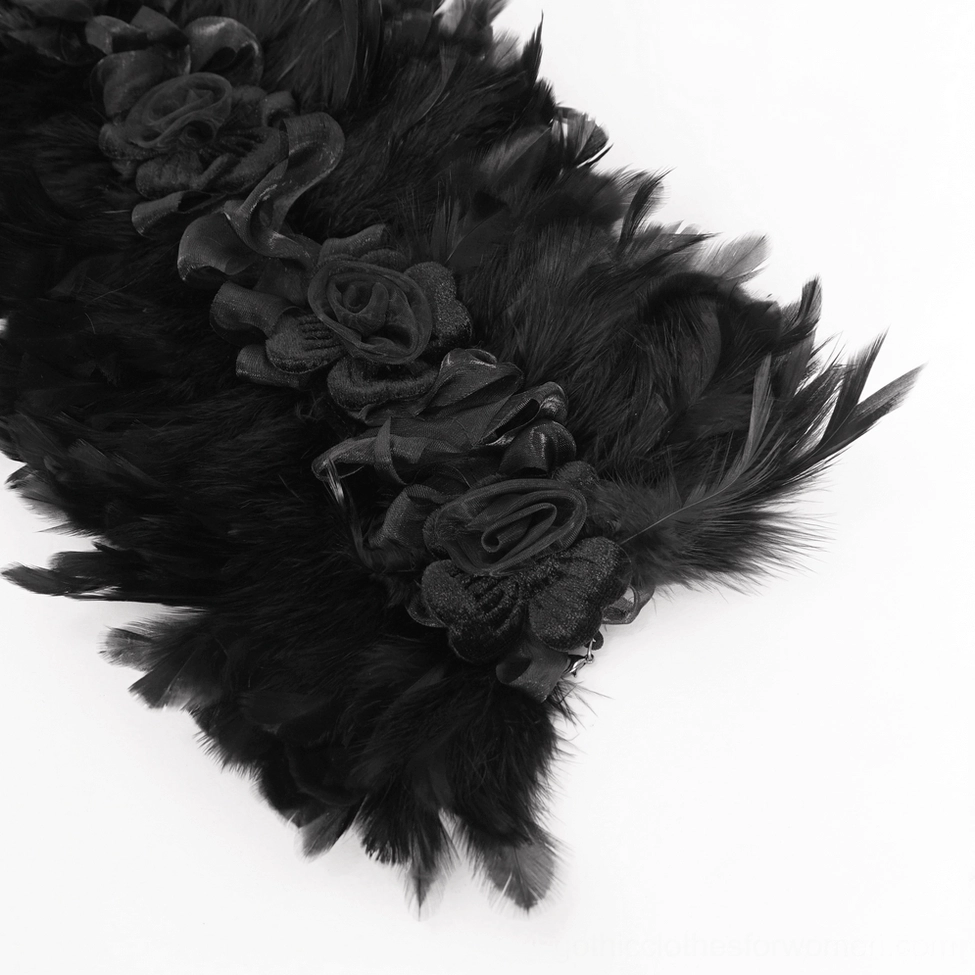 Extreme close-up of black feather texture and embossed fabric roses on gothic choker