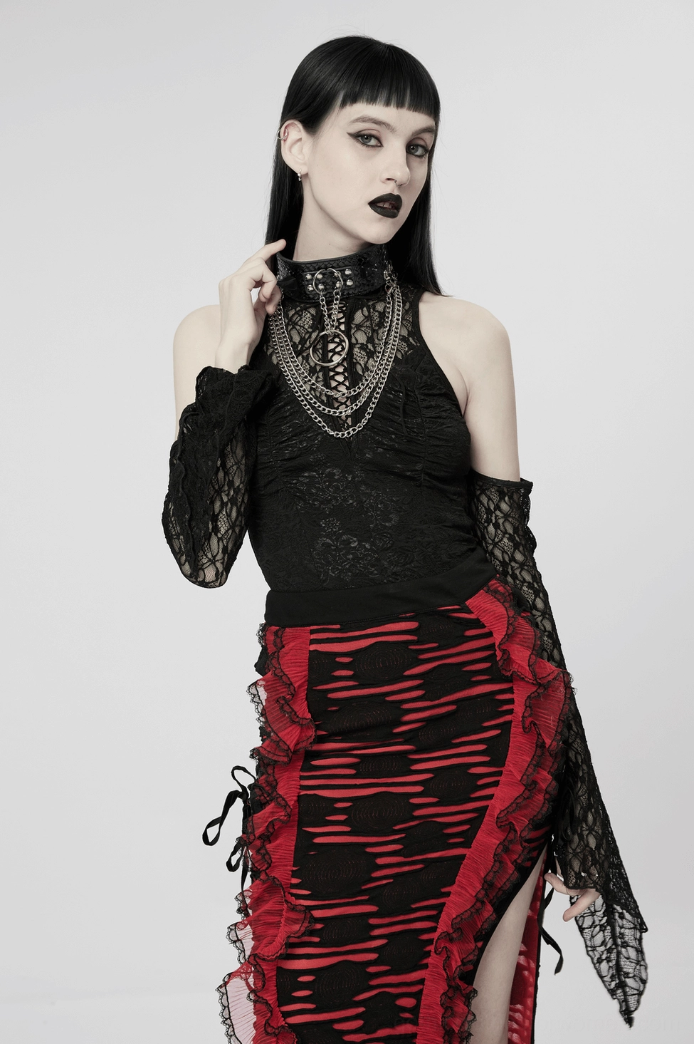 Full body studio view of black python grain choker paired with patterned skirt and lace top, side angle