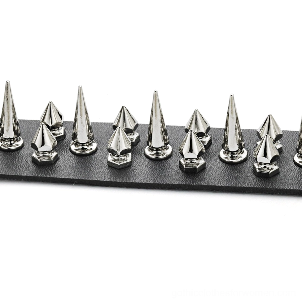 Close-up detail of black gothic choker showing conical silver spikes and small metal studs embellishments on PU leather