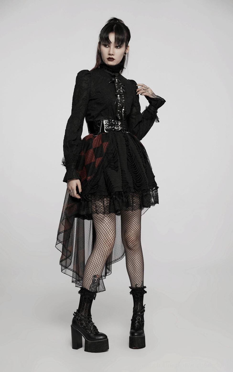 Full-body gothic outfit featuring black choker tie with skull lock pendant, high-low skirt, fishnet stockings, and platform boots on model