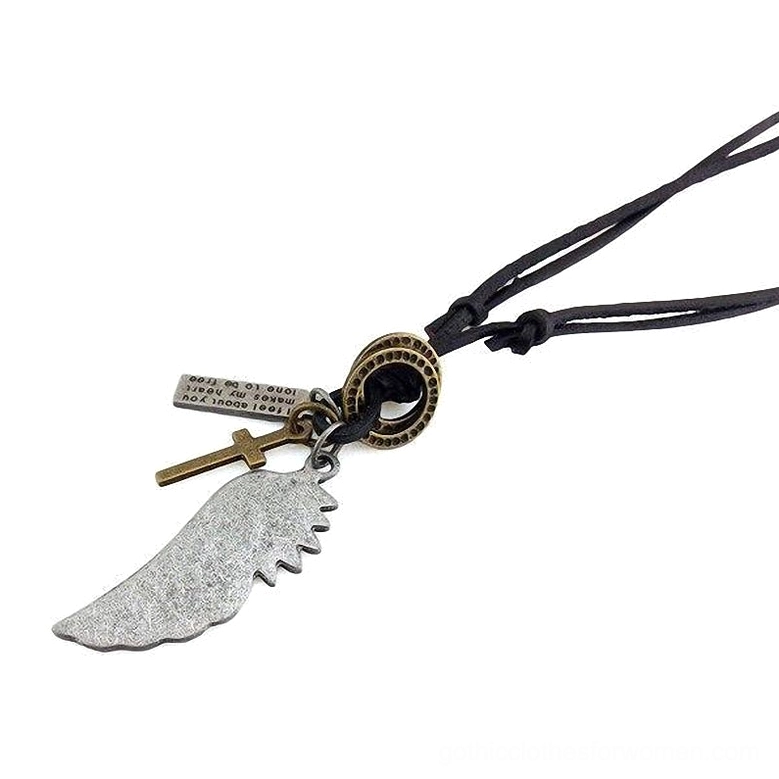 Black cord gothic choker necklace with silver angel wing, cross, and text tag charm pendants, side-angle flat lay composition